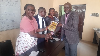 VC Presents a plaque to Mr. Oyedipe